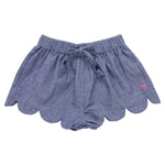 The Pink Chicken Girls' Scallop Short features a blue chambray fabric, scalloped hem, elastic waistband, front drawstring, and a pink embroidered logo—perfect for summer days.