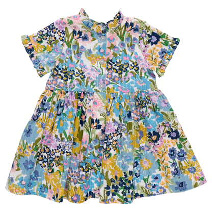 The Pink Chicken Girls' Autumn Dress features short sleeves, a charming collar, and a vibrant floral print in blue, yellow, pink, and green—ideal for adding cheerful style to her wardrobe.