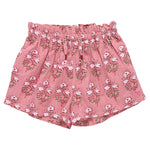 The Girls' Theodore Short by Pink Chicken features a charming white floral block print and an elastic waistband.