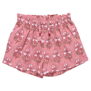 The Girls' Theodore Short by Pink Chicken features a charming white floral block print and an elastic waistband.