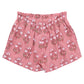 The Girls' Theodore Short by Pink Chicken features a white and red floral print with green leaves and an elastic waistband. Pair with the Girls Ava Top for a stylish look.