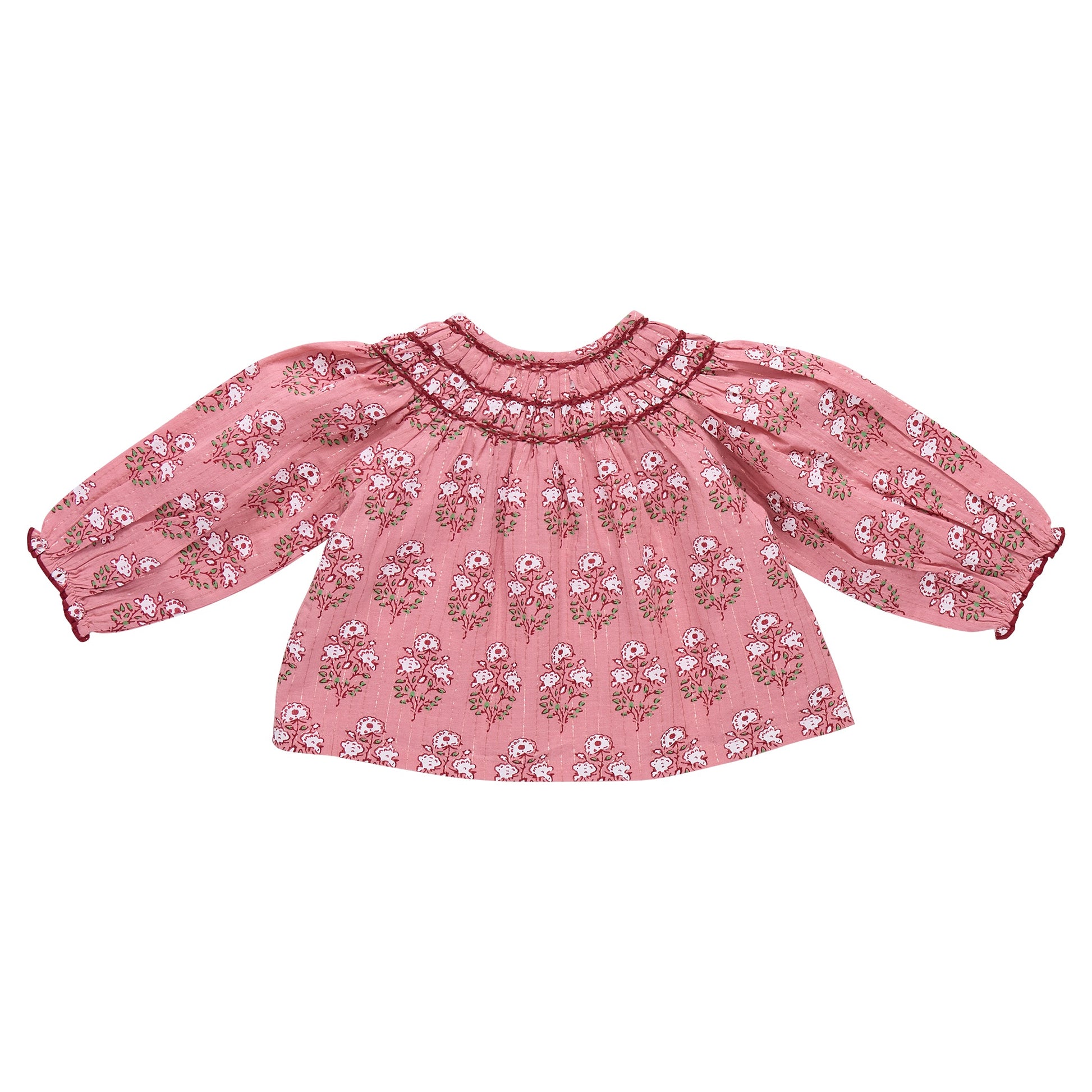 The Girls' Ava Top by Pink Chicken features a pink strawflower block print, smocked neckline, and loose gathered long sleeves. Shown on a white background.