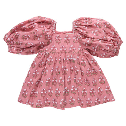 The Girls' Mary Barrett Dress by Pink Chicken features pink strawflower print, puffed short sleeves, a square neckline, and a gathered skirt—perfect as a twirl dress for girls.