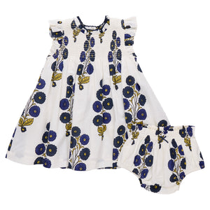 The Pink Chicken Baby Girls' Stevie Dress features short ruffled sleeves and comes with matching bloomers, both in a charming Navy Buttercup Floral print of blue and yellow.