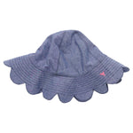 The Pink Chicken Baby Scallop Sun Hat is a blue chambray sun hat with a scalloped brim and a small pink embroidered detail on the side, shown on a white background.