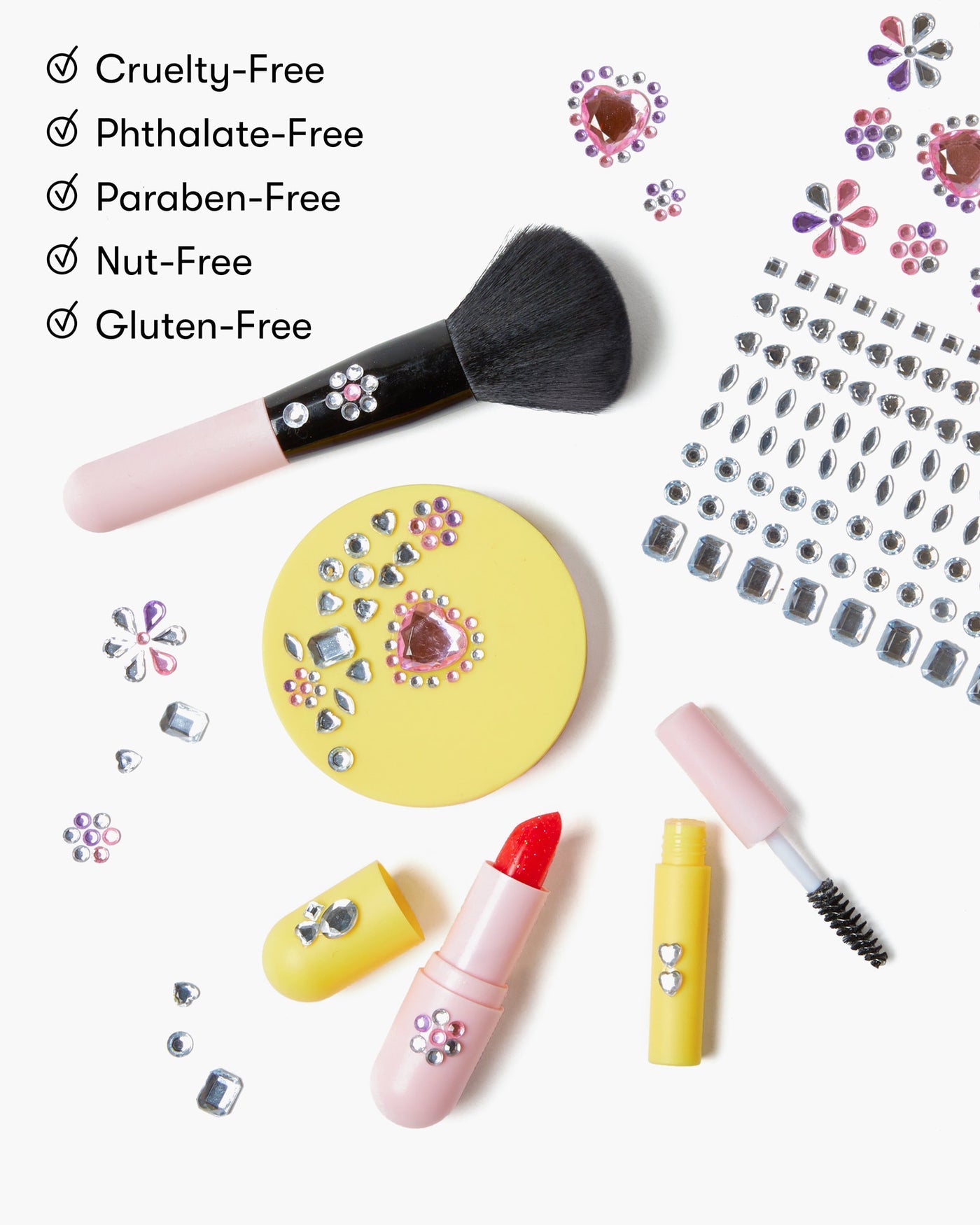 Super Smalls Mom's Makeup Play Kit features decorative jeweled makeup on a white background, plus a checklist: Cruelty-Free, Phthalate-Free, Paraben-Free, Nut-Free, Gluten-Free—ideal as safe kids' makeup or real makeup for children.
