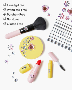 Super Smalls Mom's Makeup Play Kit features decorative jeweled makeup on a white background, plus a checklist: Cruelty-Free, Phthalate-Free, Paraben-Free, Nut-Free, Gluten-Free—ideal as safe kids' makeup or real makeup for children.