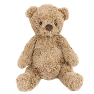 Mon Ami’s Huggie Bear is a light brown plush teddy with dark eyes and a dark brown nose, crafted from ultra-soft fabric. Sitting upright against a plain white background, it’s perfect for cozy cuddles.