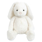 The Mon Ami Magnolia Bunny - Cream features long floppy ears, black eyes, and a pink nose. This plush toy sits upright against a white background—perfect as an Easter gift.