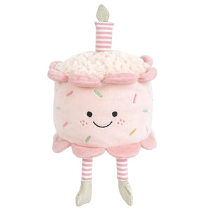 Celebrate with Mon Ami’s Birthday Cake - Pink, a plush shaped like a smiling pink cake, topped with a pink striped candle and featuring pink striped legs with silver shoes. This cuddly treat makes every birthday extra sweet!.