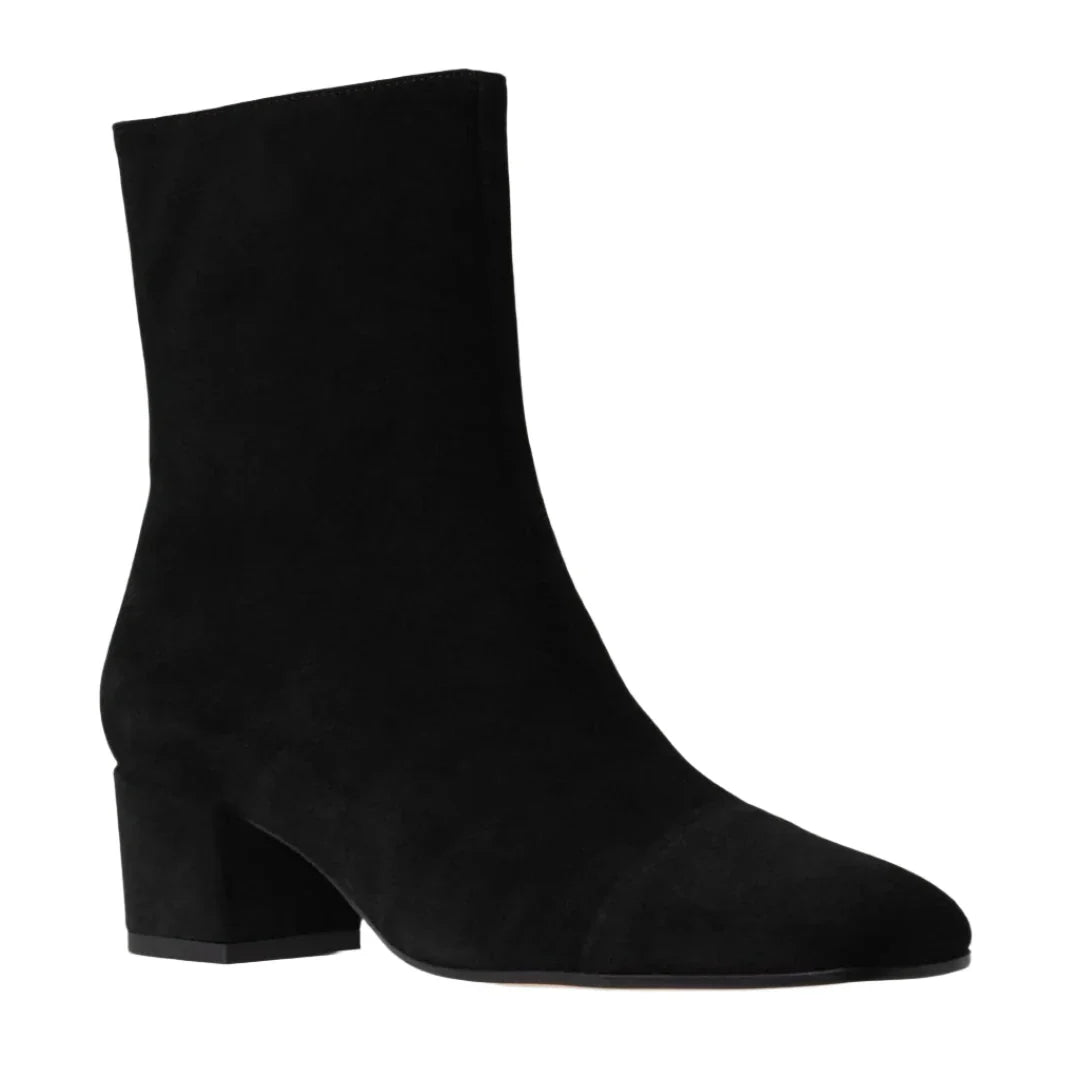 The Aimee Short Boot by Staud is a black suede ankle bootie with a mid-height block heel and pointed toe, featuring a convenient side zipper, shown against a white background.