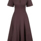 The Staud Frances Dress is a brown, short-sleeved midi poplin dress with a fitted bodice, flared A-line skirt, and V-shaped split neckline, crafted from soft cotton poplin.