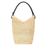 The Staud Lani Raffia Bucket Bag features beige raffia with a black leather handle, showcased on a white background—an everyday essential for effortless style.