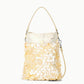 The Staud Lila Mini Bag is a cream-colored bag featuring a top handle, crossbody strap, and overlapping round shell-like accents—a chic accessory for both daytime outings and evening events.