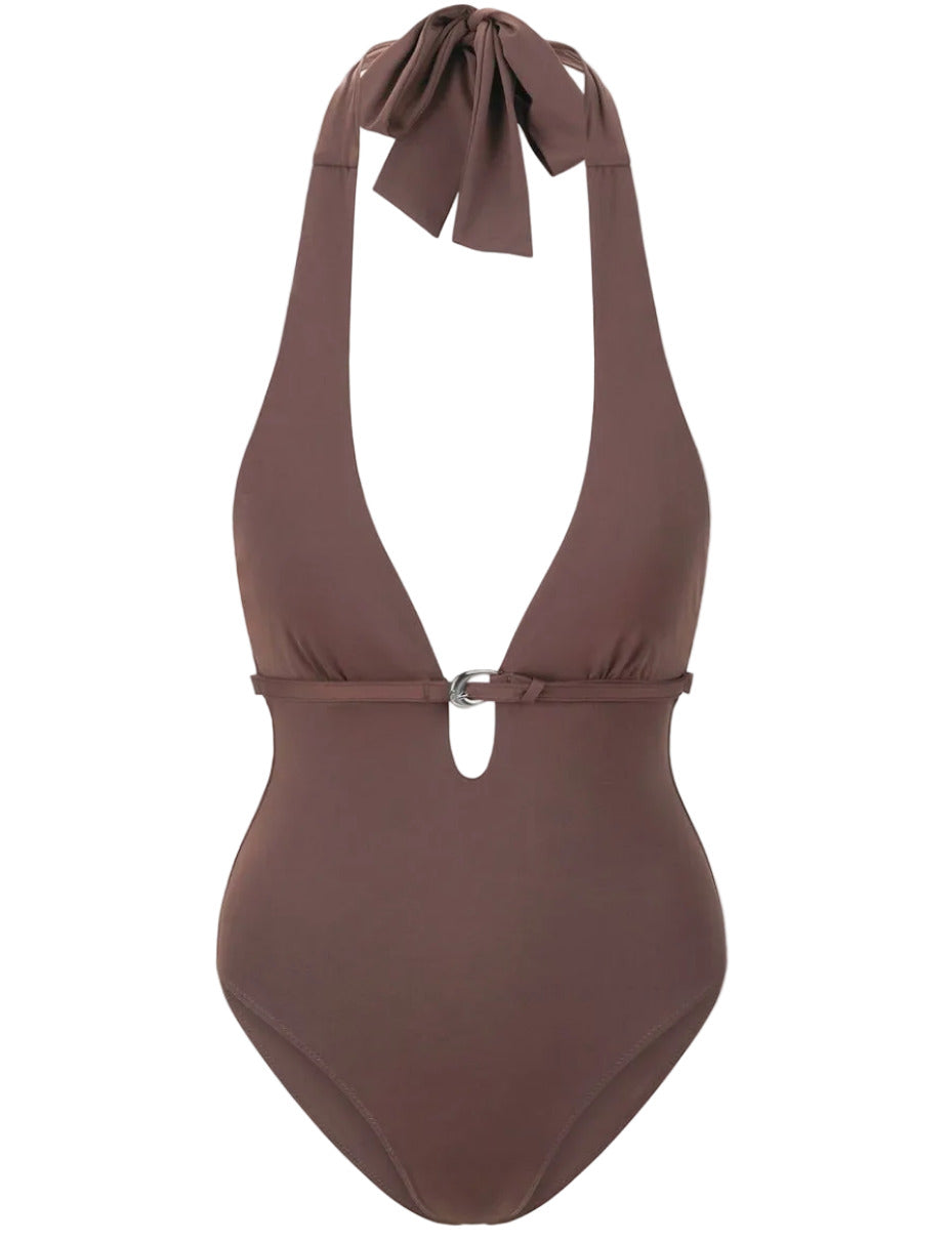 The Staud La Jolla One Piece is a brown halter swimsuit with a deep V neckline, moon buckle at the bust, and a large bow tie accenting the low back.