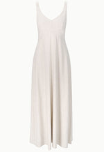 The Staud Madison Linen Dress is a sleeveless, ankle-length stretch linen dress in light beige with a breathable fabric and a flattering V-neck fitted bodice.