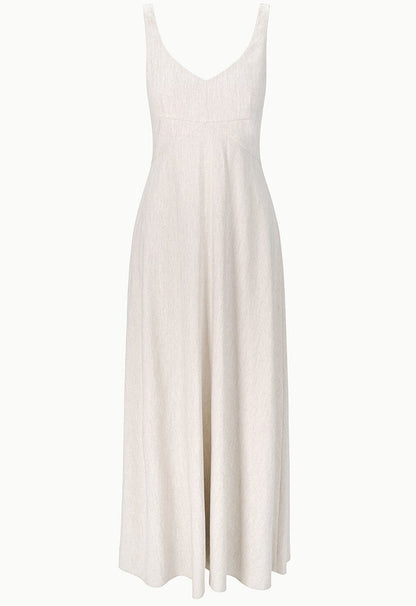 The Staud Madison Linen Dress is a sleeveless, ankle-length stretch linen dress in light beige with a breathable fabric and a flattering V-neck fitted bodice.