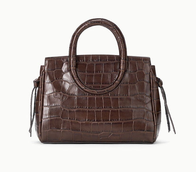 Staud Maude Mini Carryall in brown croc-embossed leather with round top handles and side ties.