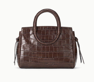 Staud Maude Mini Carryall in brown croc-embossed leather with round top handles and side ties.