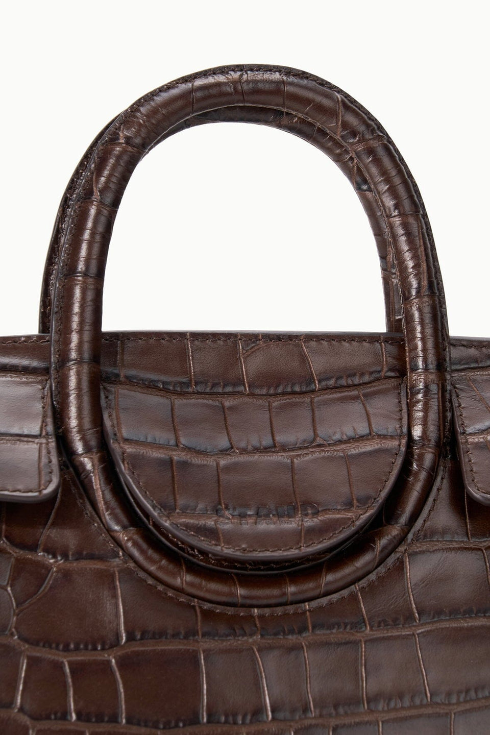 Close-up of a brown croc-embossed leather Staud Maude Mini Carryall with a rounded top handle and a fold-over flap.