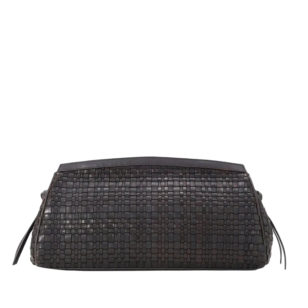 The Staud Maude Woven Soft Clutch is a rectangular black leather bag featuring side tassels and a signature knotted tie, shown against a white background.