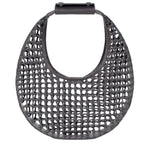 The Staud Moon Hand-Knotted Tote Bag features a black, round, open-weave leather lattice design with a solid top handle.