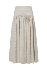 The Staud Procida Skirt is a white midi skirt featuring thin vertical black stripes, a wide horizontal striped waistband, and a hidden back zipper for a seamless finish.