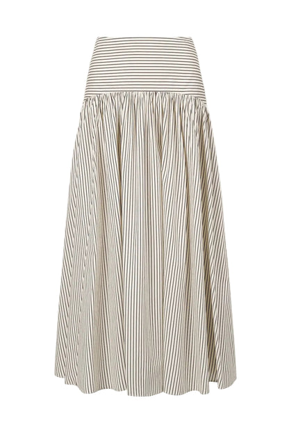 The Staud Procida Skirt is a white midi skirt featuring thin vertical black stripes, a wide horizontal striped waistband, and a hidden back zipper for a seamless finish.