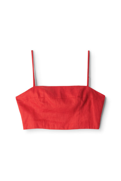 The Federico Linen Tank by Staud is a red linen cropped top with thin, adjustable spaghetti straps, shown against a plain white background.