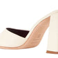A white leather mule with a chunky block heel, like the Staud Sloane Heel by Staud.