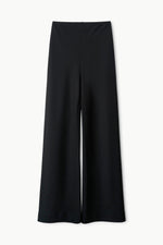 The Staud Stroll Pant, featuring a black high-waisted straight leg silhouette and an elastic waistband, is displayed flat against a white background.
