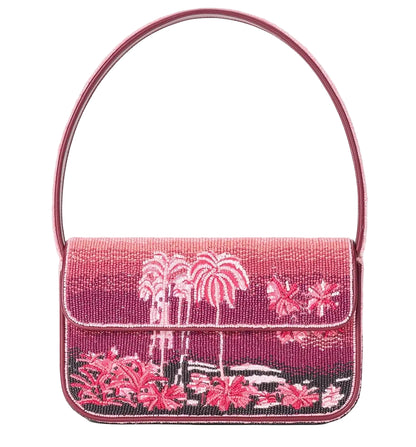 Staud Tommy Beaded Bag in pink with hand-beaded tropical palm tree and floral design, vegan leather accents, single top handle, and a rectangular shape.