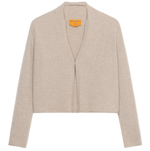 The Stealth Cardigan by Guest in Residence is a beige, cropped cashmere cardigan with long sleeves and an open front, shown against a white background.