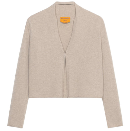 The Stealth Cardigan by Guest in Residence is a beige, cropped cashmere cardigan with long sleeves and an open front, shown against a white background.