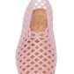 Introducing the Steve Madden Kids Girls’ Grovee Jelly Flat: a lightweight, pink plastic shoe featuring a stylish lattice pattern and cork insole. Photographed from above against a white background, this slip-on flat is perfect for kids seeking everyday comfort and style.