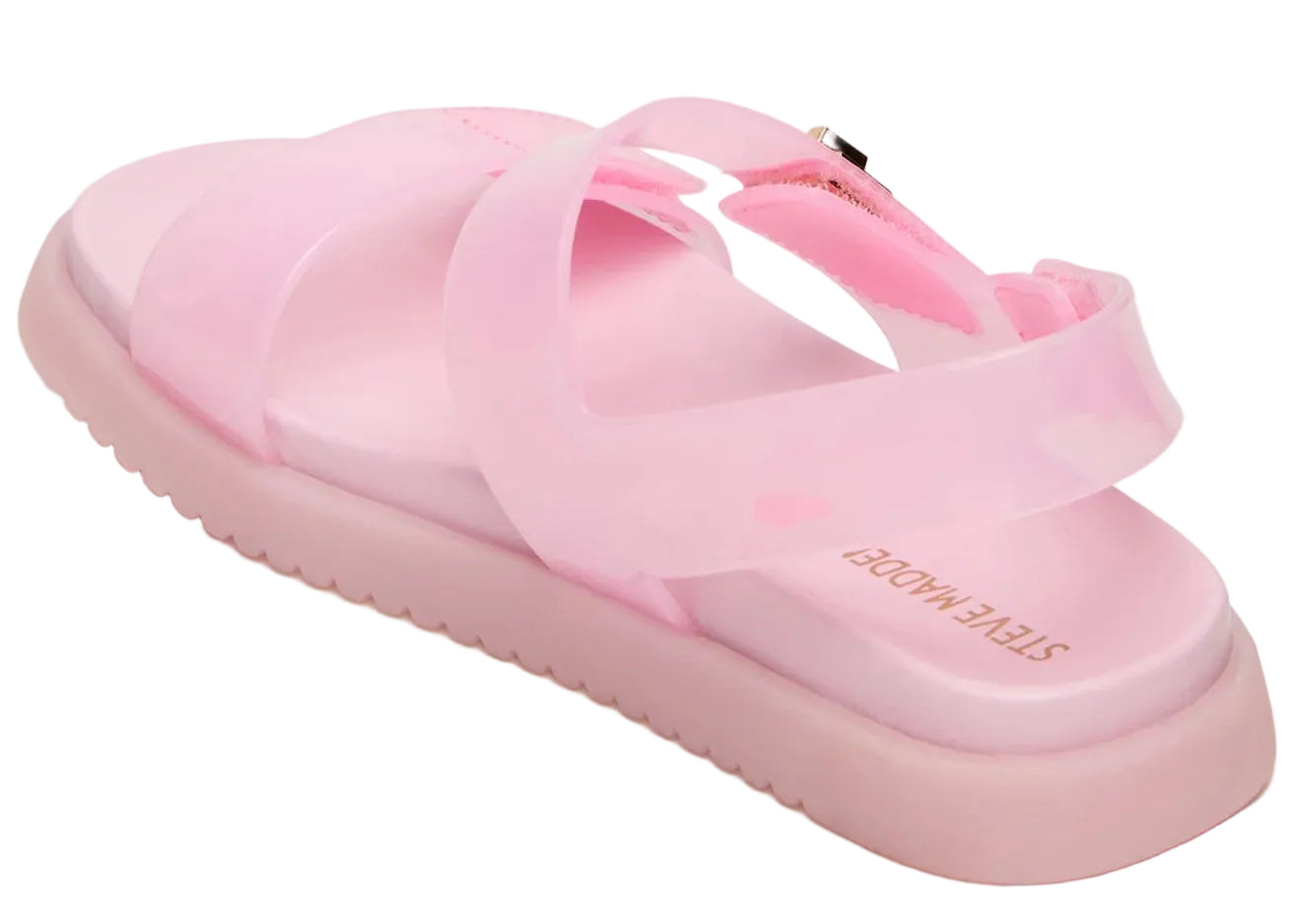 A rear view of the Girls’ Jelly Mona Sandal by Steve Madden Kids, featuring pink translucent crisscross straps and a thick flatform sole. The insole is stamped with “STEVE MADDEN” in gold letters.