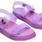 Introducing the Steve Madden Kids Girls’ Jelly Mona Sandal—a stylish pair of purple sandals featuring translucent straps, chic gold buckle accents, and a charming red heart design on the insole. The flatform silhouette offers trendy flair and added comfort, making them perfect for your little fashionista’s all-day adventures.