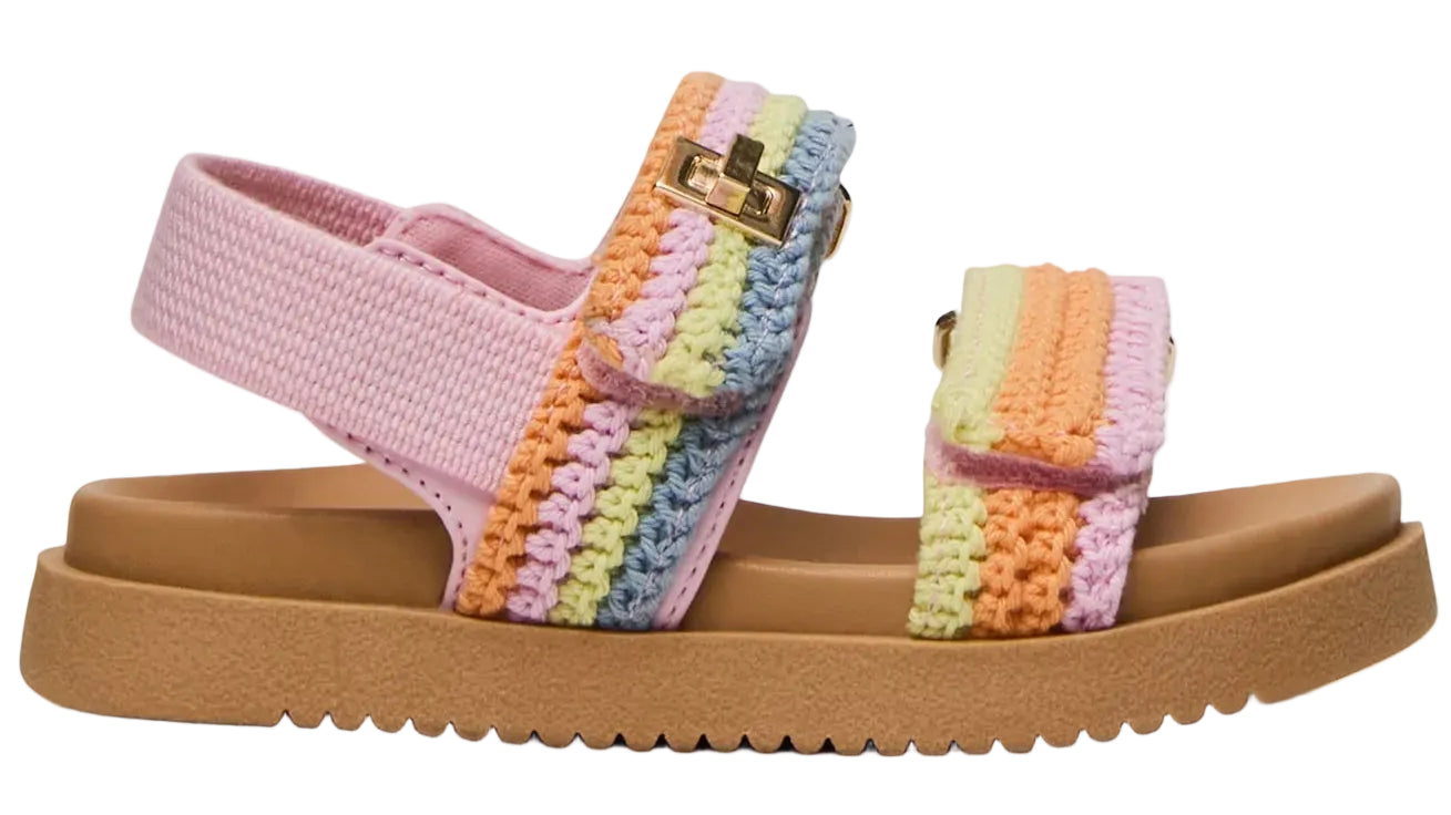The Steve Madden Kids Toddlers’ Mona Sandal features a tan sole, a pink base, and pastel crochet straps in shades of pink, yellow, green, blue, and orange with a gold buckle detail. This charming slingback sandal offers comfort and playful style for little feet.