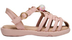 The Steve Madden Kids Toddlers’ Pocket Charmed Sandal is a light pink children’s sandal featuring multiple straps, a closed heel, a gold buckle, and a decorative bead with colorful accents on top.
