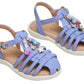 A pair of Steve Madden Kids Toddlers’ Pocket Charmed Sandals in light purple, featuring white soles and strappy straps adorned with colorful beads and star-shaped charms.