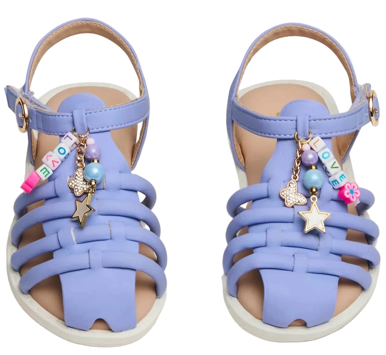 A pair of Toddlers’ Pocket Charmed Sandals by Steve Madden Kids, in lavender, featuring ankle straps and decorative charms—including beads, stars, and blocks spelling “LOVE.”.