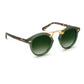 Krewe STL II Sunglasses feature an oversized green round frame with a gold metal bridge, gradient green lenses, and dark arms accented by a tortoiseshell pattern—an elegant nod to the cast-iron balconies of the French Quarter.