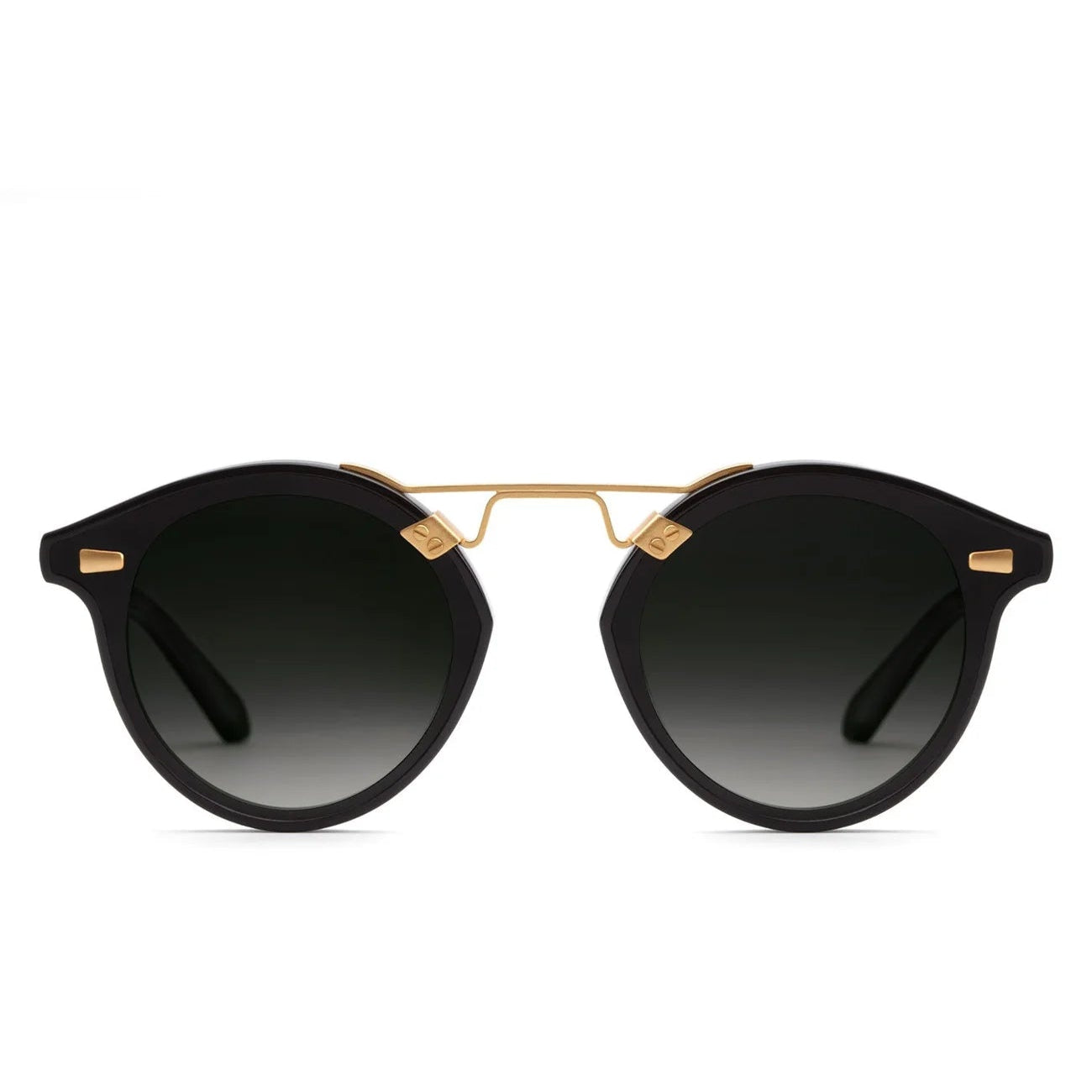 The Krewe STL Nylon Polarized Sunglasses feature an oversized round black frame with gold accents and dark gradient flat nylon lenses, shown on a white background.
