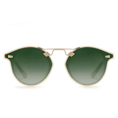 Krewe STL Nylon Mirrored Sunglasses feature gold frames, round oversized silhouette, and green gradient flat nylon lenses, displayed front-facing against a white background.
