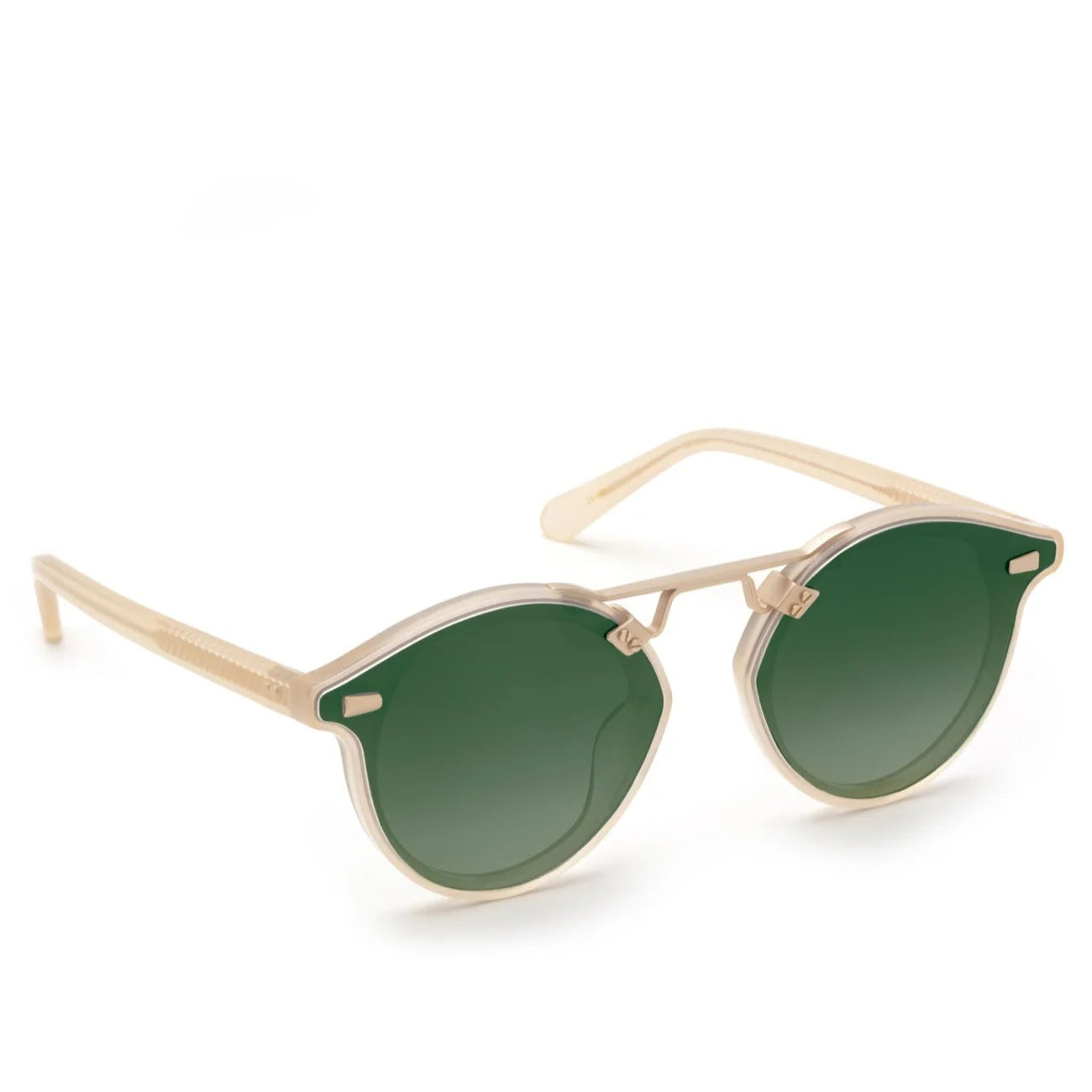 Krewe STL Nylon Mirrored Sunglasses feature a beige frame, rounded oversized silhouette, flat round green nylon lenses, and slightly pointed temples. Displayed on a white background.