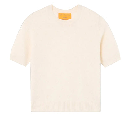 The Compass Sweater Tee by Guest in Residence is a women's lightweight cream cashmere short-sleeve sweater with a classic crew neck and knit design, shown flat on a white background.
