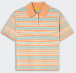 The Short Sleeve Stripe Rugby by Guest in Residence features orange, white, and light blue stripes with a solid orange collar and partial button placket for a stylish layered look.