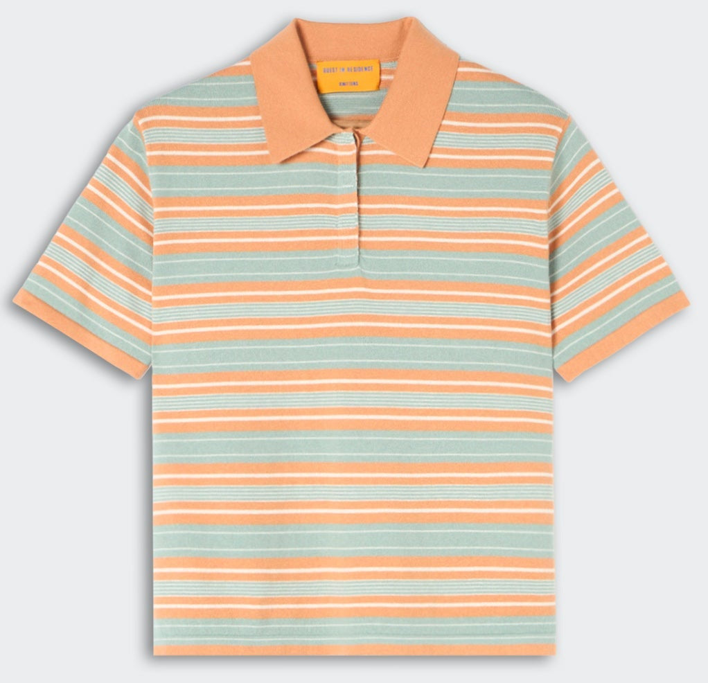 The Short Sleeve Stripe Rugby by Guest in Residence features orange, white, and light blue stripes with a solid orange collar and partial button placket for a stylish layered look.