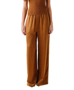 A person wearing Sablyn Lexi Lower Rise Relaxed Pull On Pants in brown with a matching sleeveless top, shown from shoulders to feet.