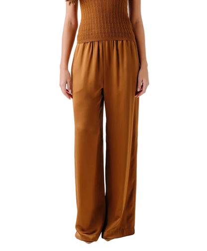 A person wearing Sablyn Lexi Lower Rise Relaxed Pull On Pants in brown with a matching sleeveless top, shown from shoulders to feet.